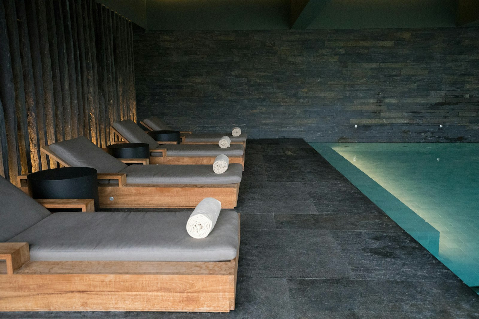 A still, minimal retreat interior beside water
