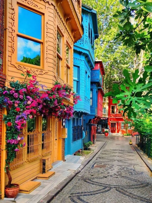 A Kuzguncuk street in Istanbul, its wooden houses painted in bright colours
